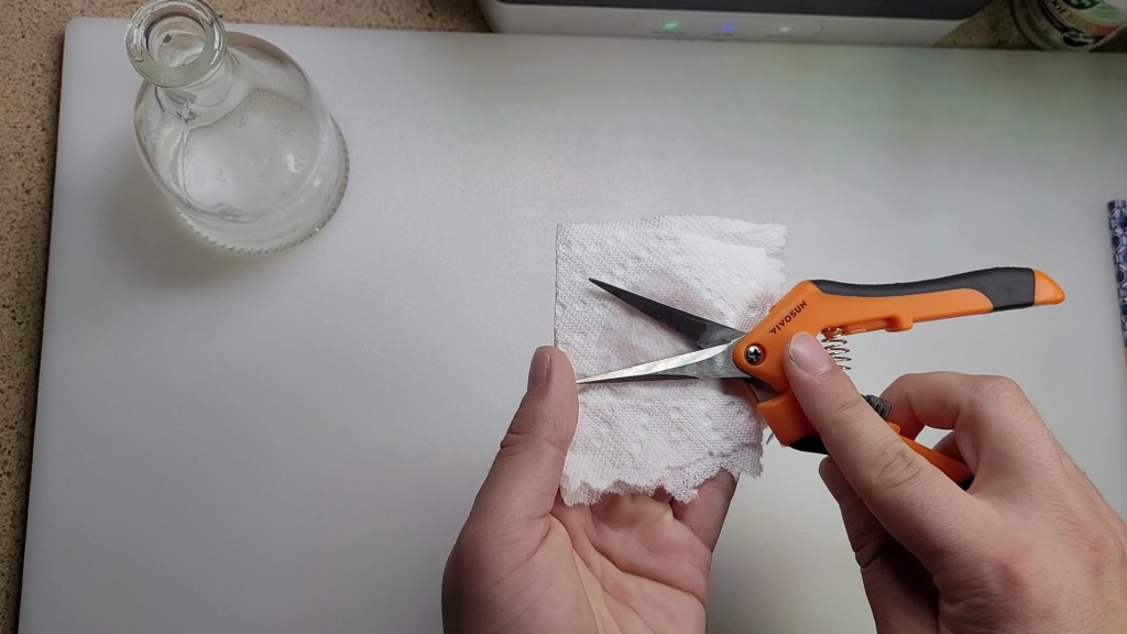 vivosun 6.5 pruning shears being disinfected with isopropyl alcohol